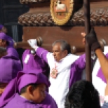 A man is seen leading the carriers of the float with the figure of Christ and the cross in Antigua, Guatemala. A Lent procession generally begins with incense carriers, the brotherhood’s banner, followed by the carriers and the float. During Lent processions, men by their turn at their local church to carry a massive float that can weigh up to 7,000 pounds. Photo taken April 10, 2011.