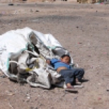 Domingo Sandoval, 4, takes a nap on top of one of the large bags his parents fill with plastic they scavenge from the Nogales, Sonora, dump. In a city where there’s no formal recycling program, waste pickers collect plastic, cardboard and aluminum to sell to private companies.